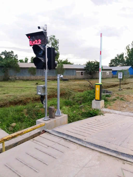 Installed boom barrier and traffic light control at the weighbridge gate. Automated boom barrier and traffic light at cement plant weighbridge gate