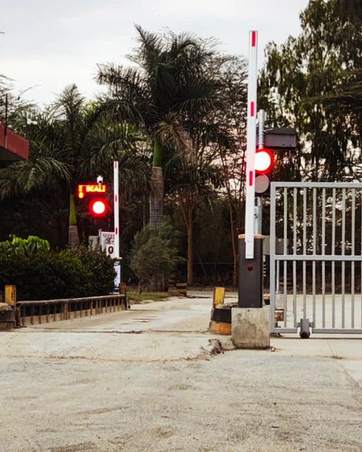 The completed, commissioned weighbridge approach at Savannah Cement. Completed automated weighbridge installation with traffic light and barrier