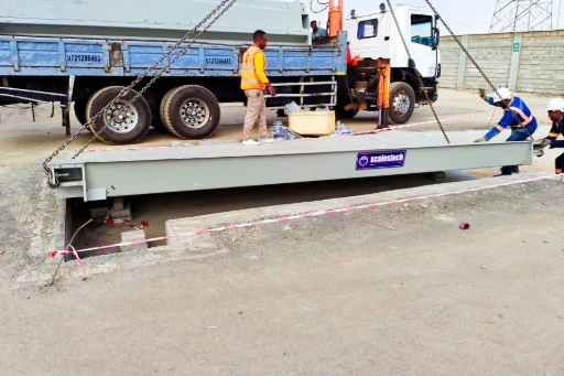 ESIT 100-ton weighbridge deck being installed at Mr. Green Africa Nairobi