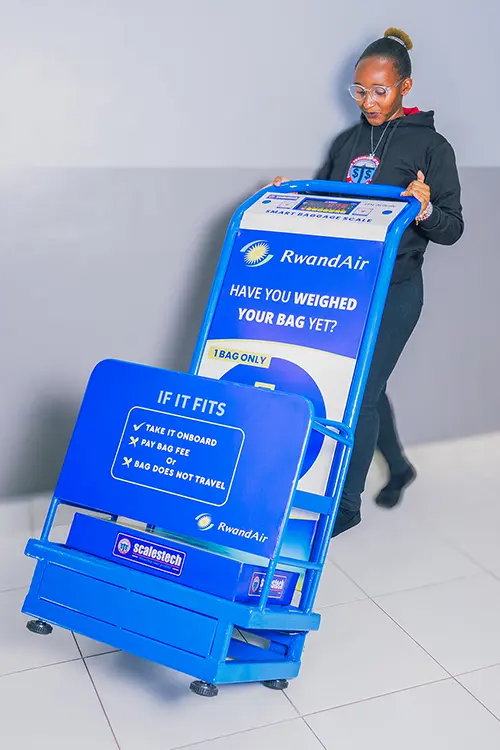 Integrated digital scale and dimension checker for airline luggage in Mombasa.